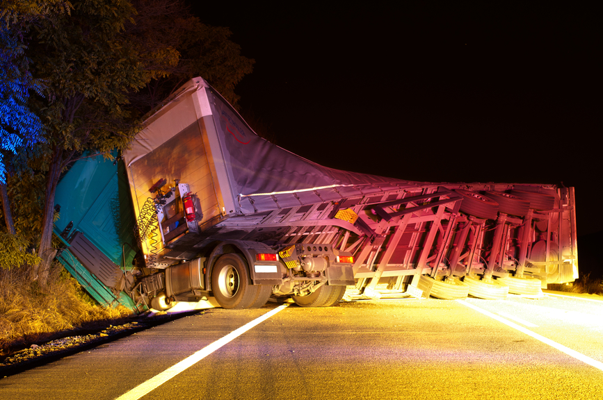 Image of a truck wreck caused by a fatigued trucker driver 