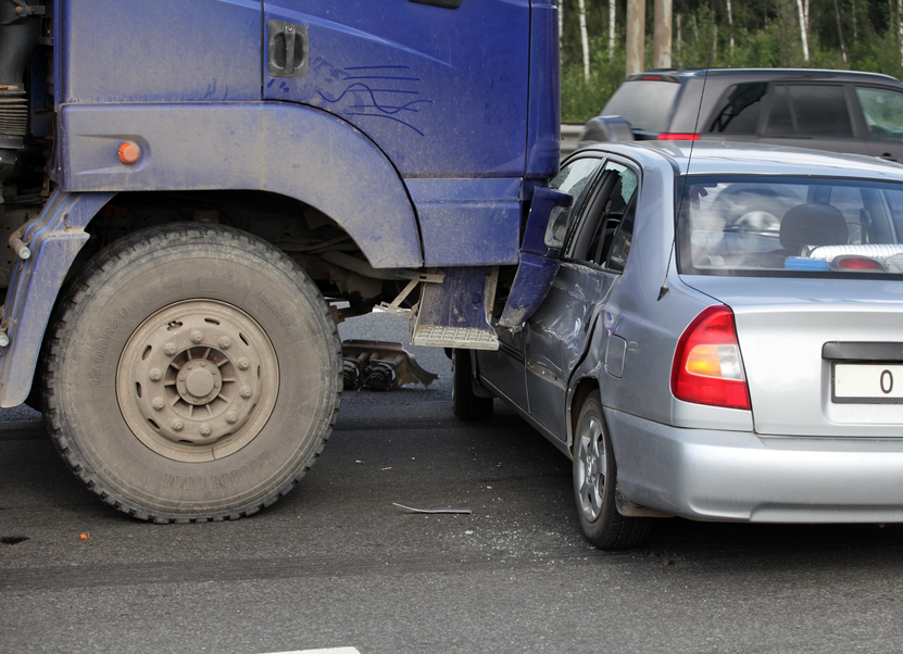 Image of a truck hitting a car. 